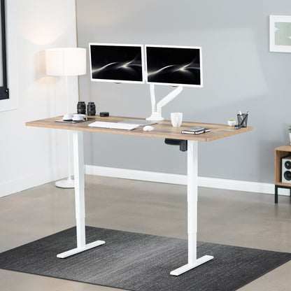 Heavy-duty electric height adjustable desktop workstation for active sit or stand efficient workspace.