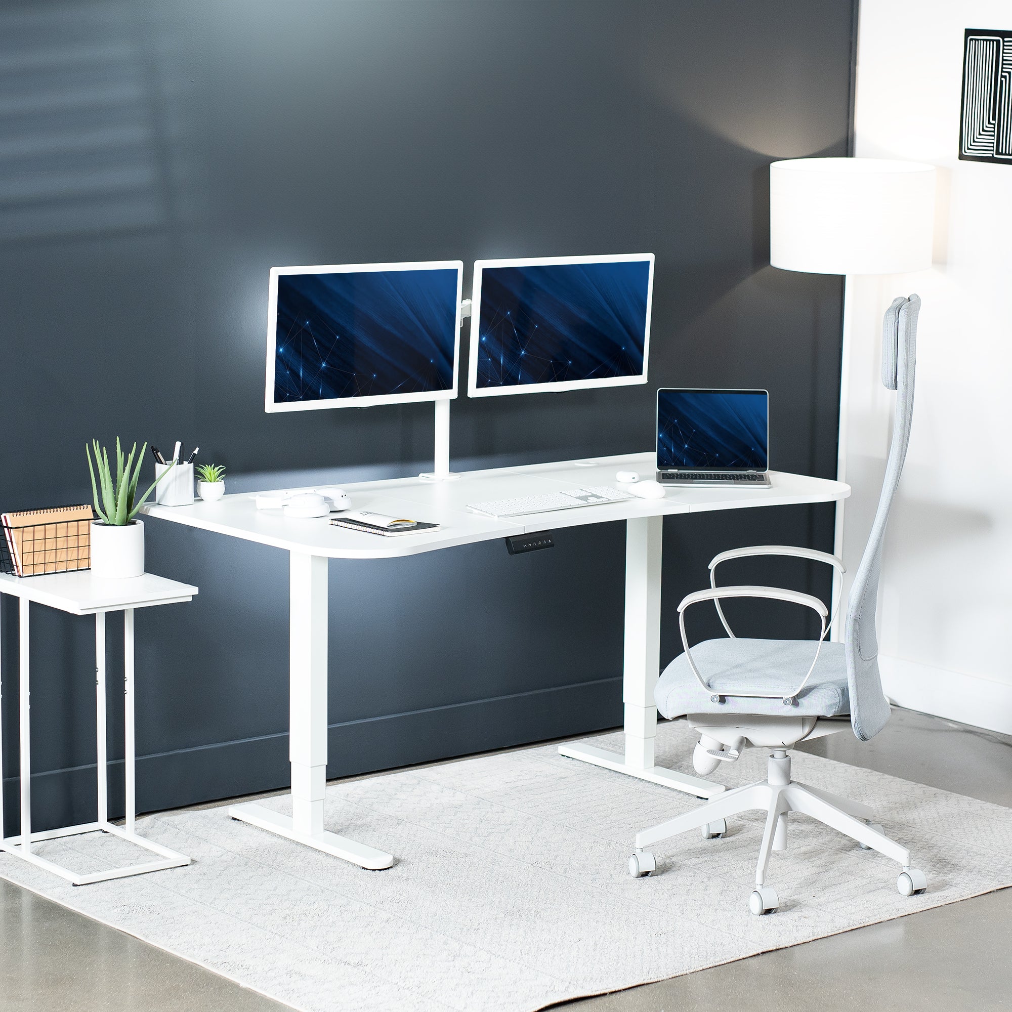 Large standing desk featuring smooth height adjustment, powerful dual motors, and a simple push-button controller featuring memory presets.