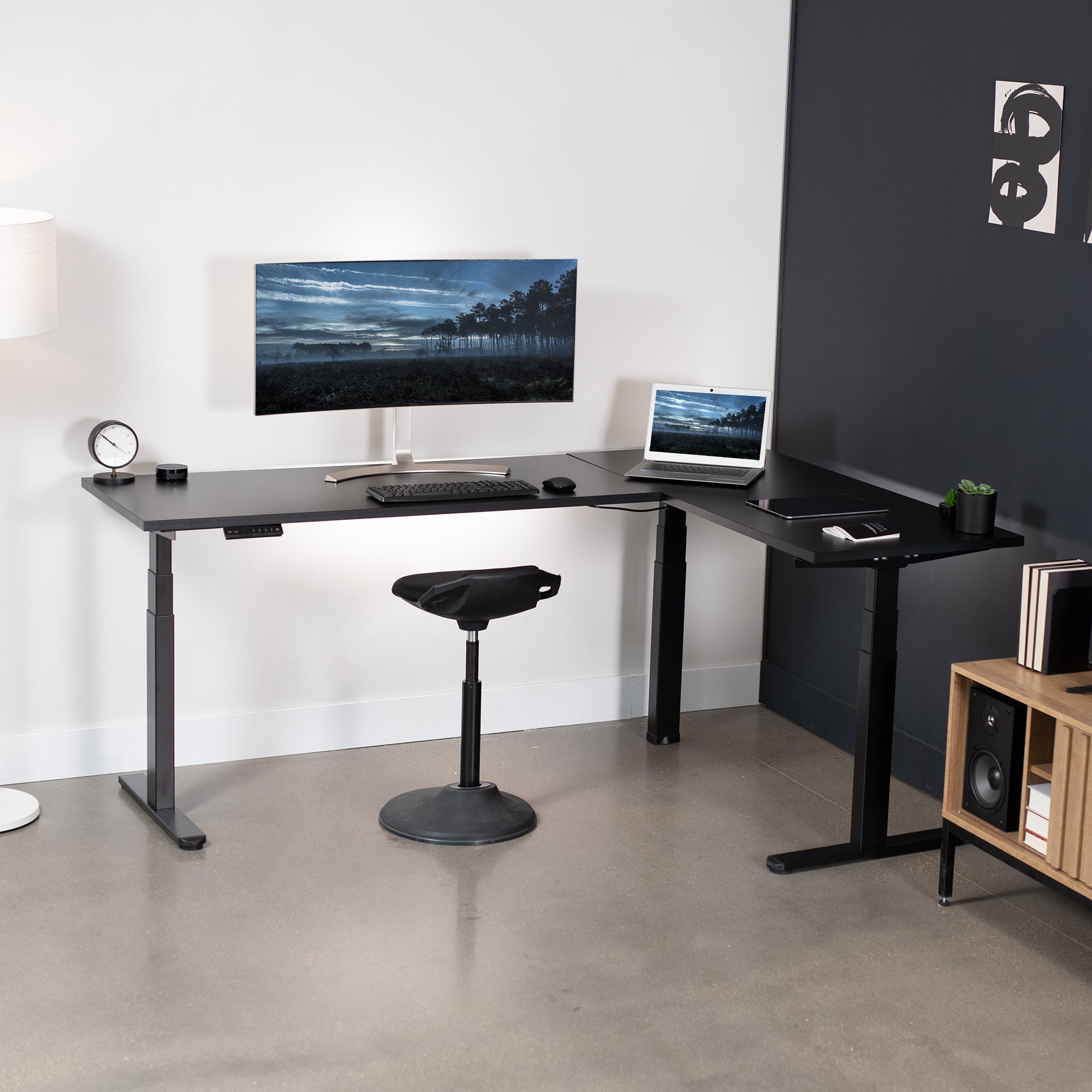 Large electric heavy-duty corner desk workstation for modern office workspaces.