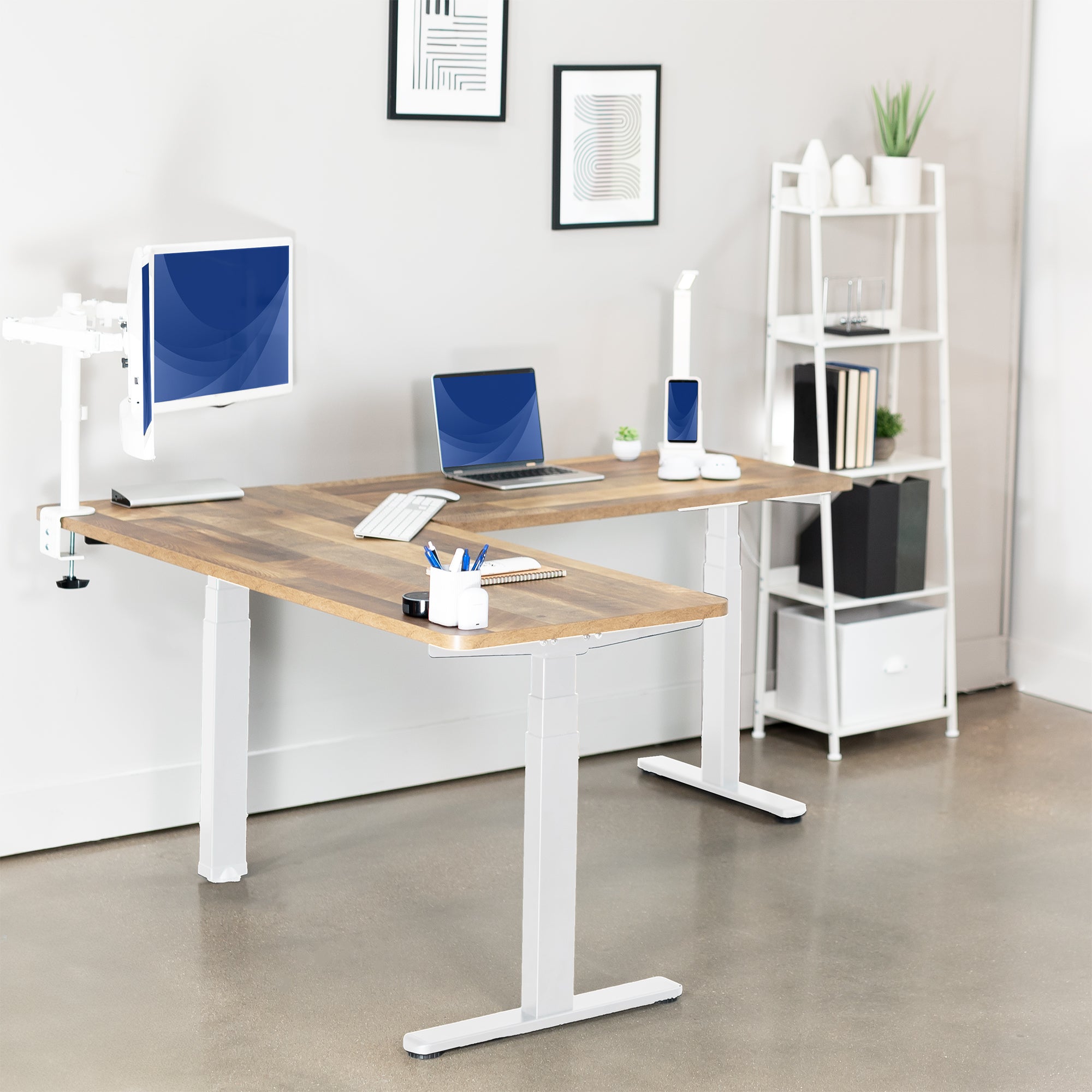 Heavy-duty electric height adjustable corner desk workstation for active sit or stand efficient workspace.