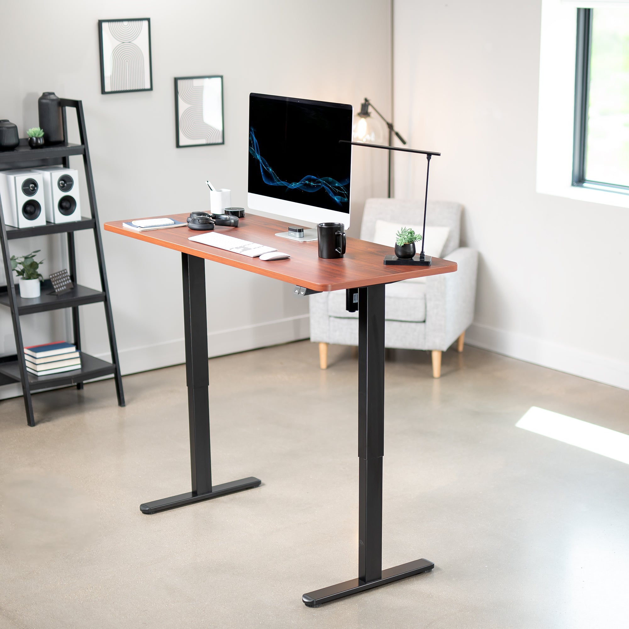 Heavy-duty electric height adjustable desktop workstation for active sit or stand efficient workspace.