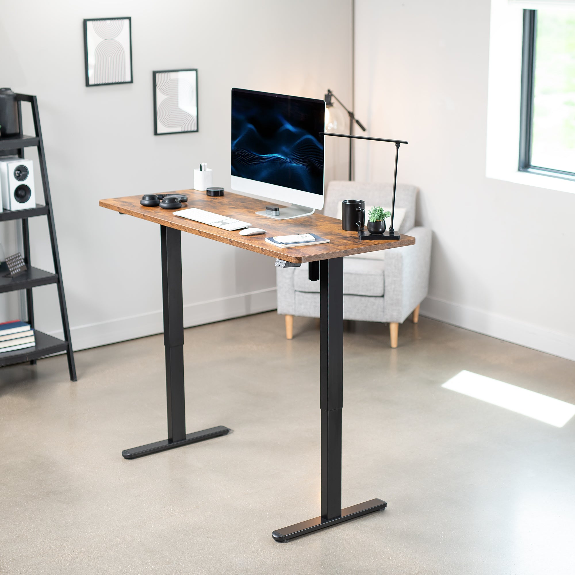 Heavy-duty electric height adjustable desktop workstation for active sit or stand efficient workspace.