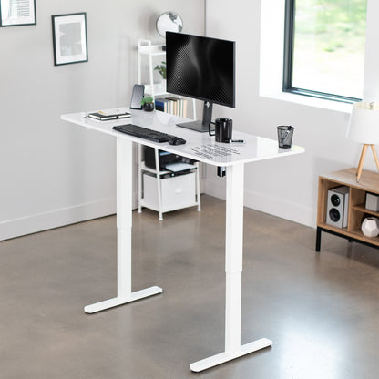 Heavy-duty electric height adjustable dry erase whiteboard desktop workstation for active sit or stand efficient workspace.