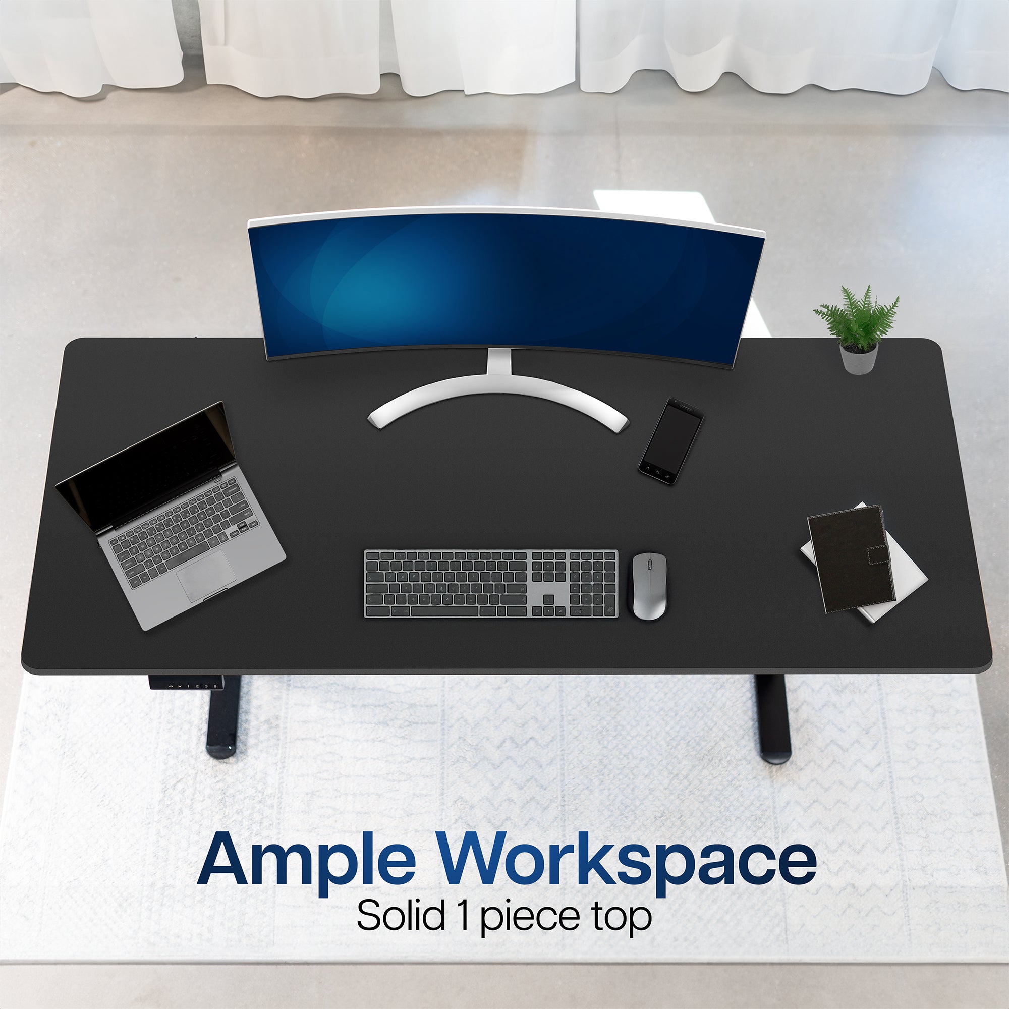 Black desk with computer setup including a monitor, laptop, keyboard, and mouse on a white floor.