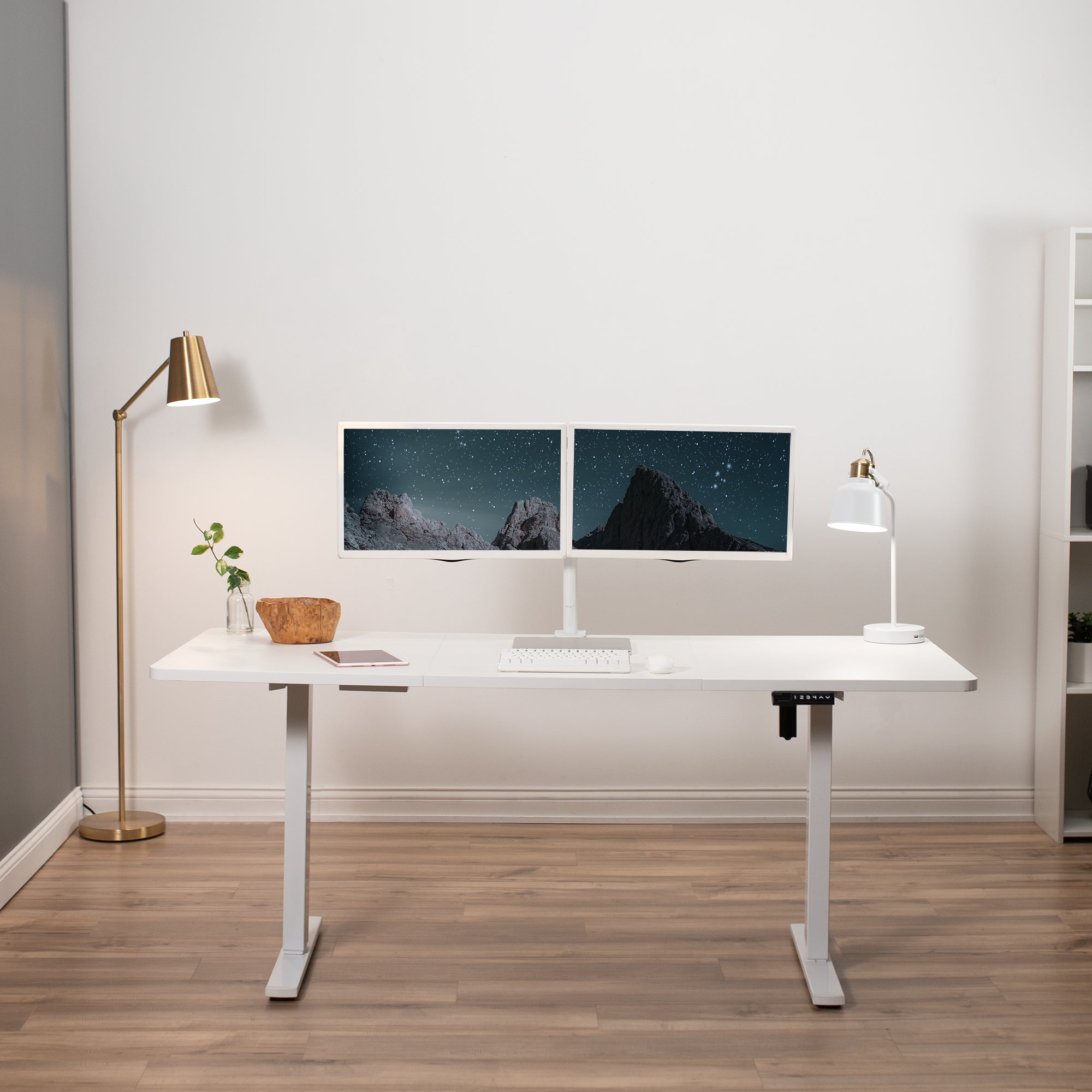 Durable sit to stand desk tabletop workstation with wide surface space.