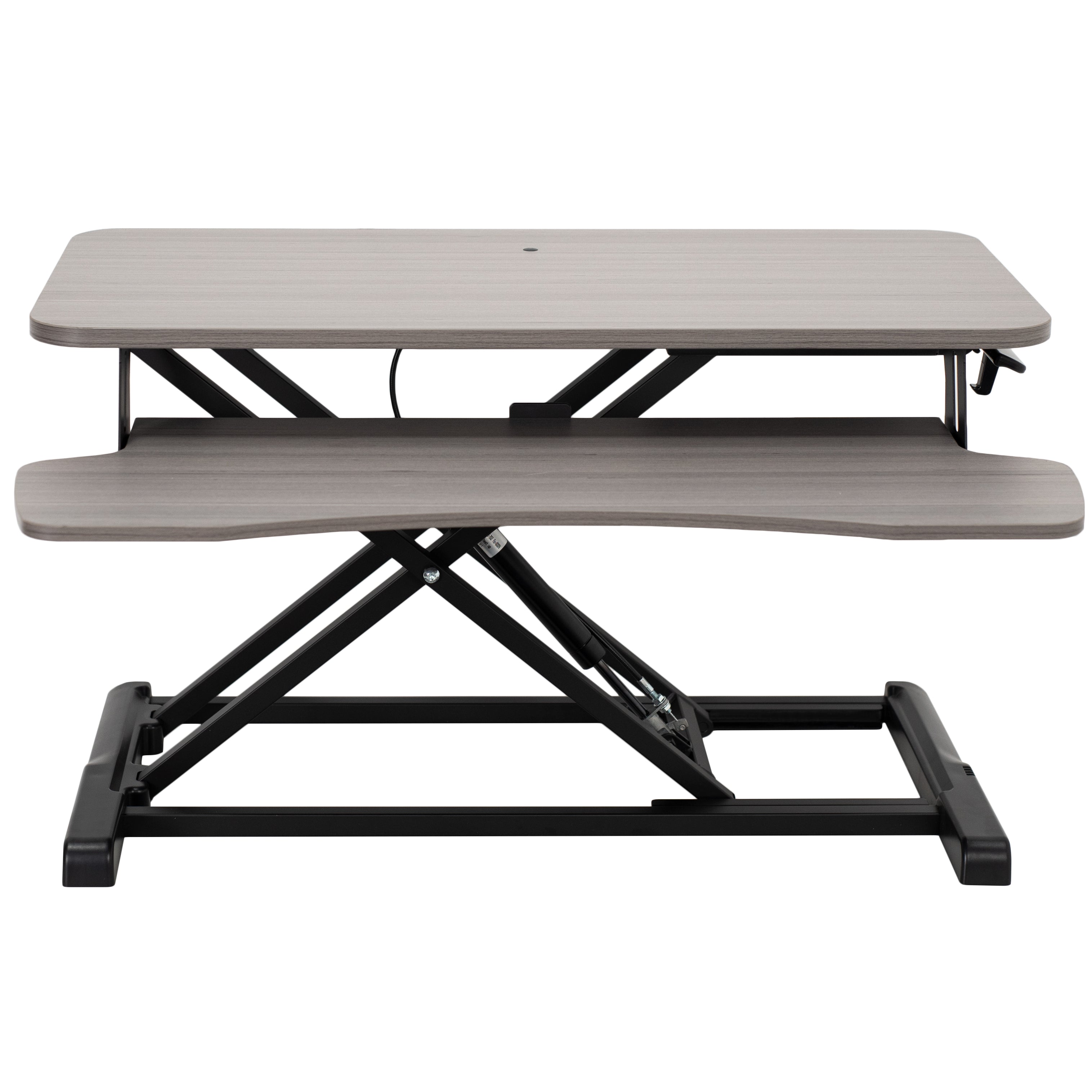 Sturdy height adjustable 2-tiered desk riser for ergonomic office workstation.