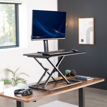 Heavy-duty height adjustable desk converter monitor riser.
