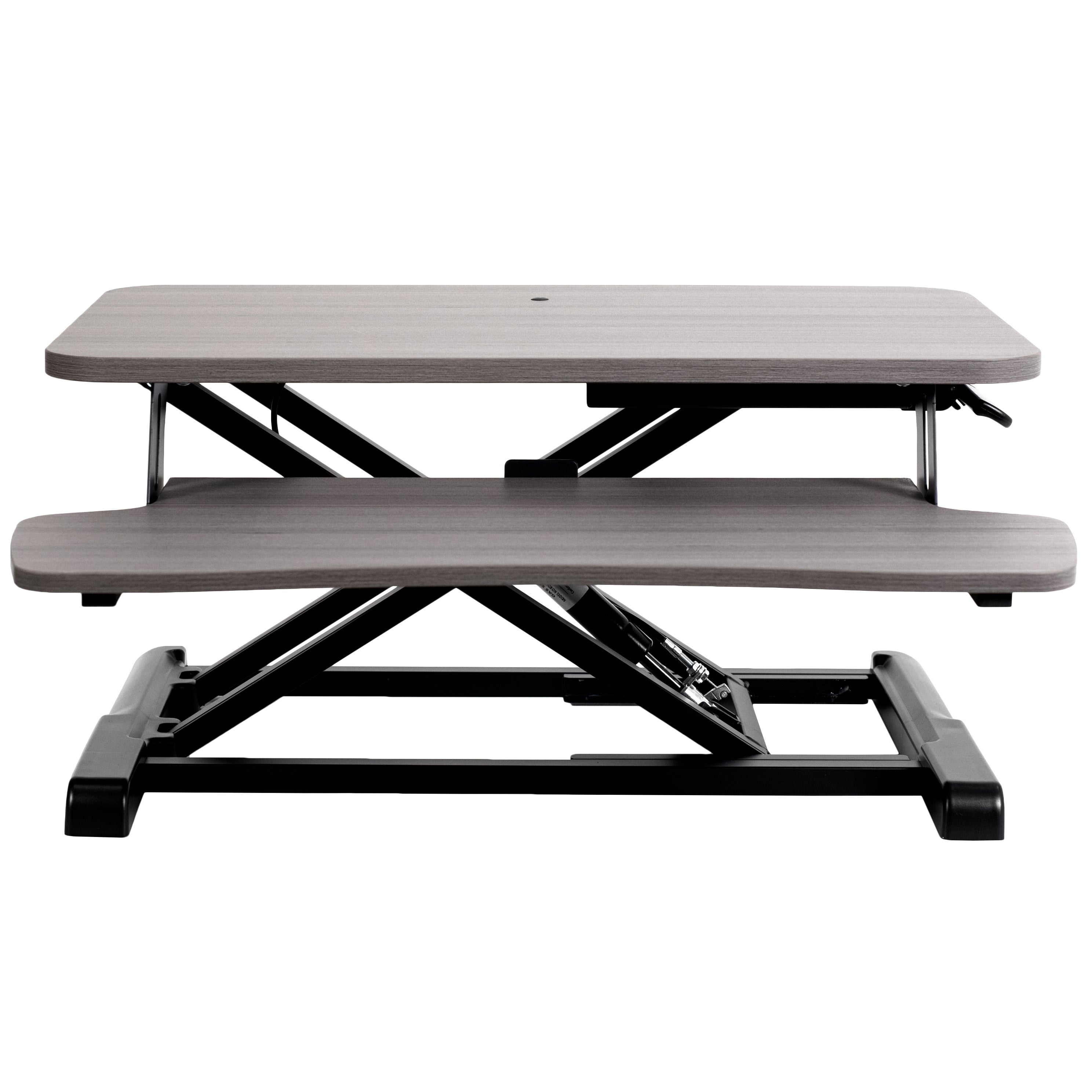 Sturdy height adjustable 2-tiered desk riser for ergonomic office workstation.