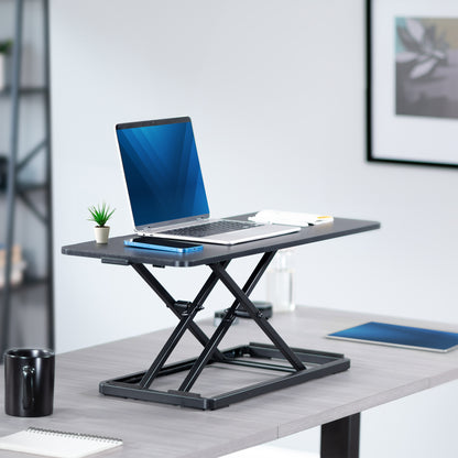 Keyboard and mouse on a keyboard desk riser from VIVO.