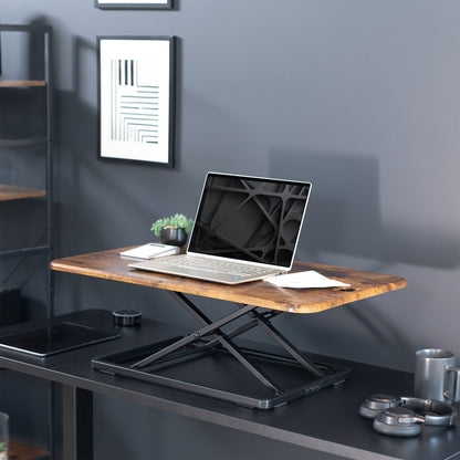 Heavy-duty height adjustable desk converter monitor riser.