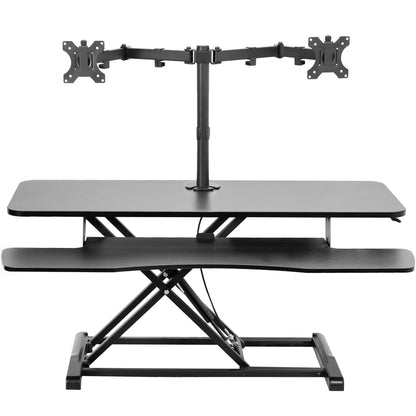 Sturdy height adjustable desk converter with articulating dual monitor mount.