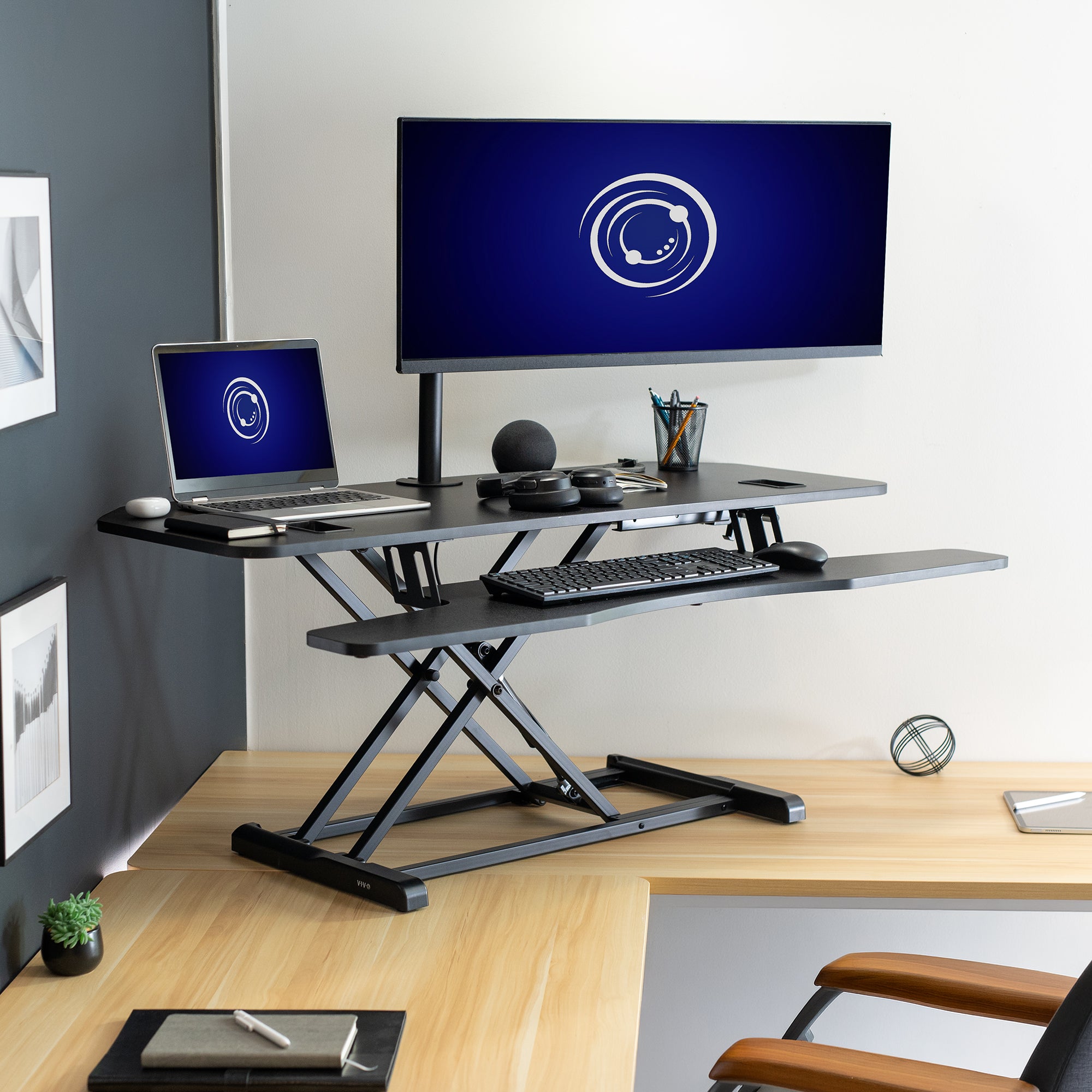 Heavy-duty large height adjustable desk converter monitor riser with 2 tiers.
