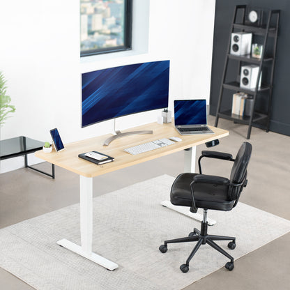 Heavy-duty sit or stand desk frame with adjustable height using touch screen control panel.