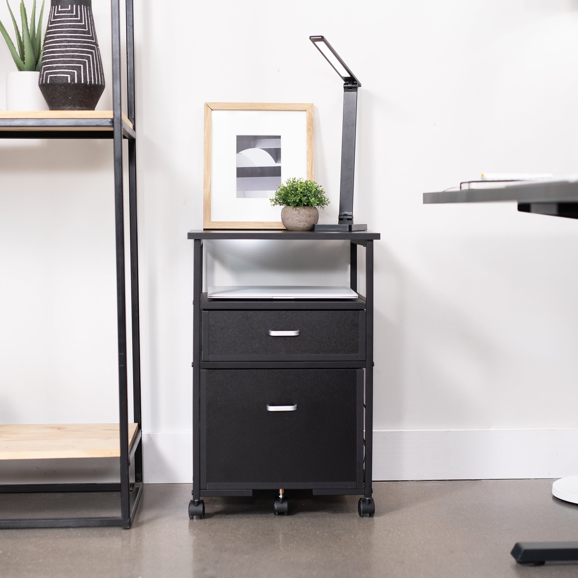 Heavy duty mobile filing cabinet with locking casters and anti-tip wheel.