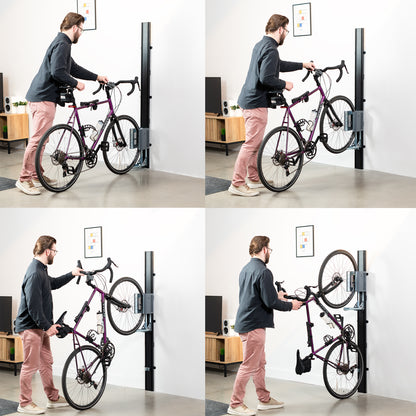 Man putting a bike in a mechanical wall mounted bike rack. 