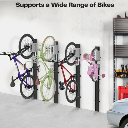 Four various sized bikes mounted on a wall in a garage. 