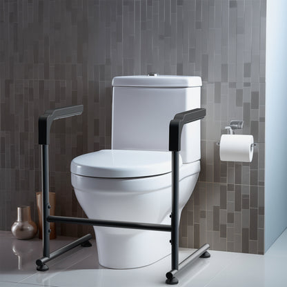 White toilet with a black stand assist frame against a gray tiled wall.