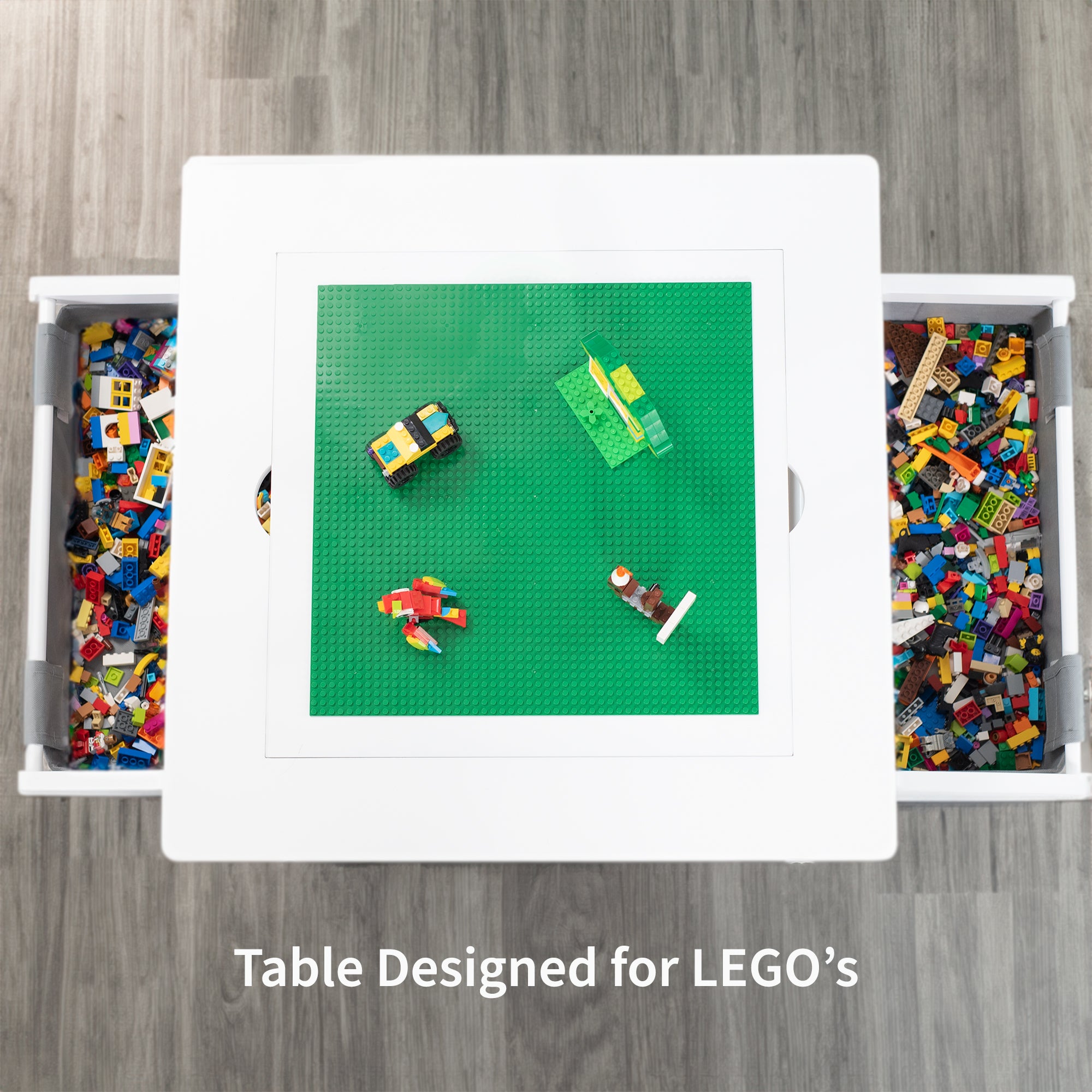 Kids' play table for Lego building bricks with reversible building base top and two pull-out drawers.