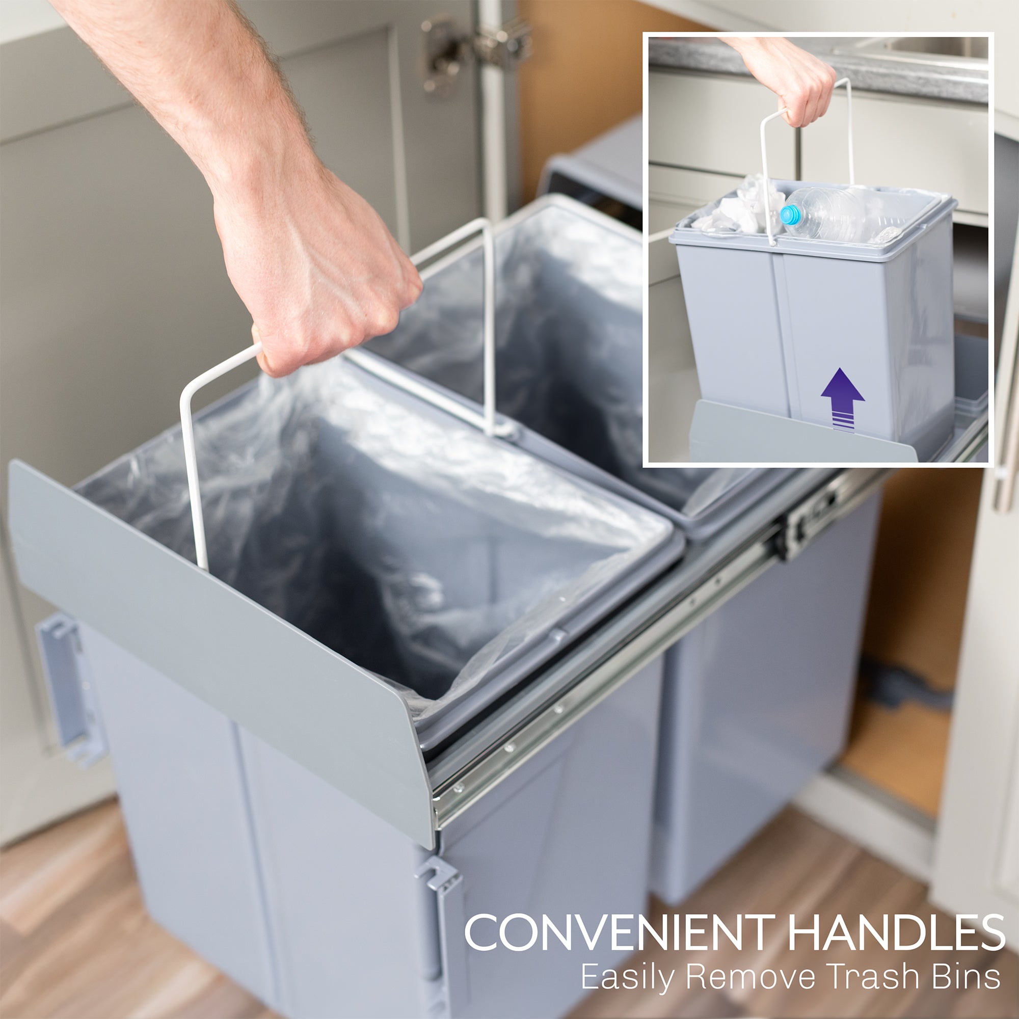 An under-counter dual trash can system with silver containers and a handle showing easy removal. 