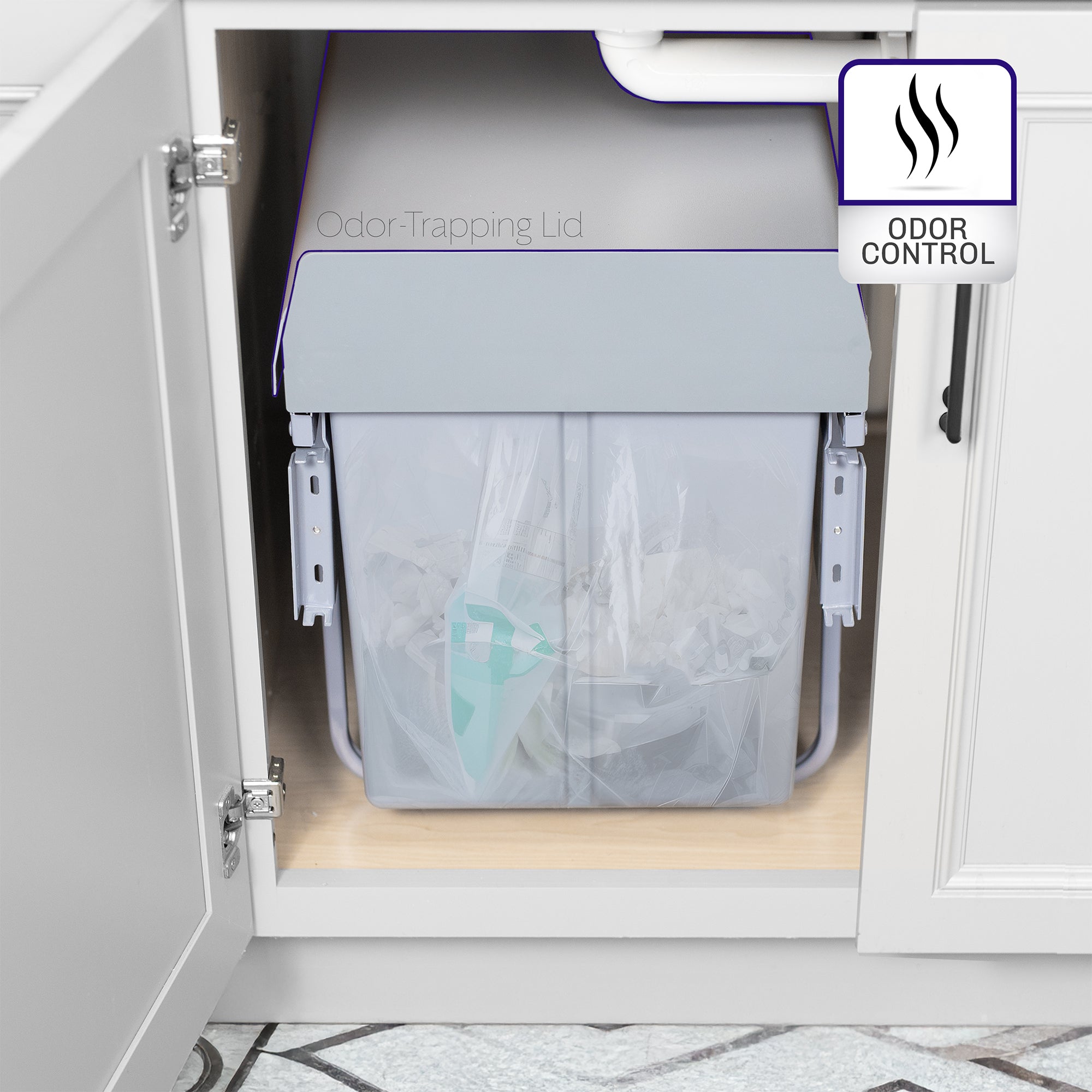 An under-counter dual trash can system with silver containers with an icon showing odor control feature. 