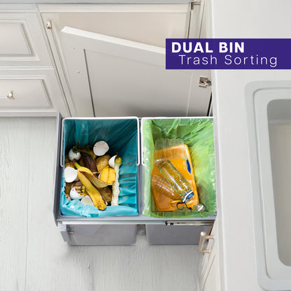 An under-counter dual trash can system with silver containers and a beige lid. 