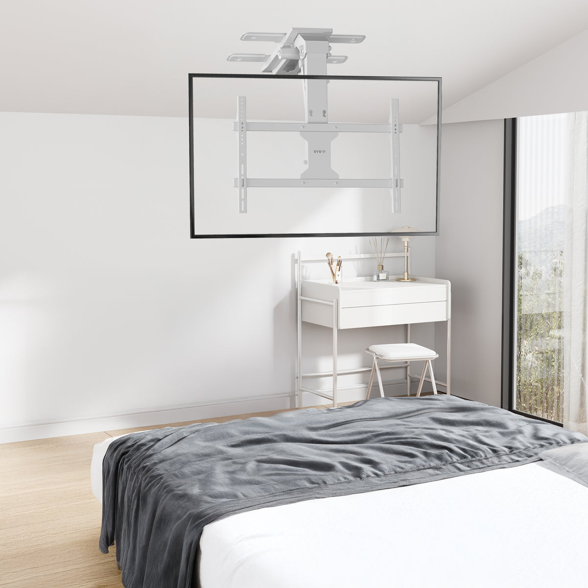 Electric Flip Down Ceiling TV Mount - 37" to 70" Screens shown on ceiling in a bedroom
