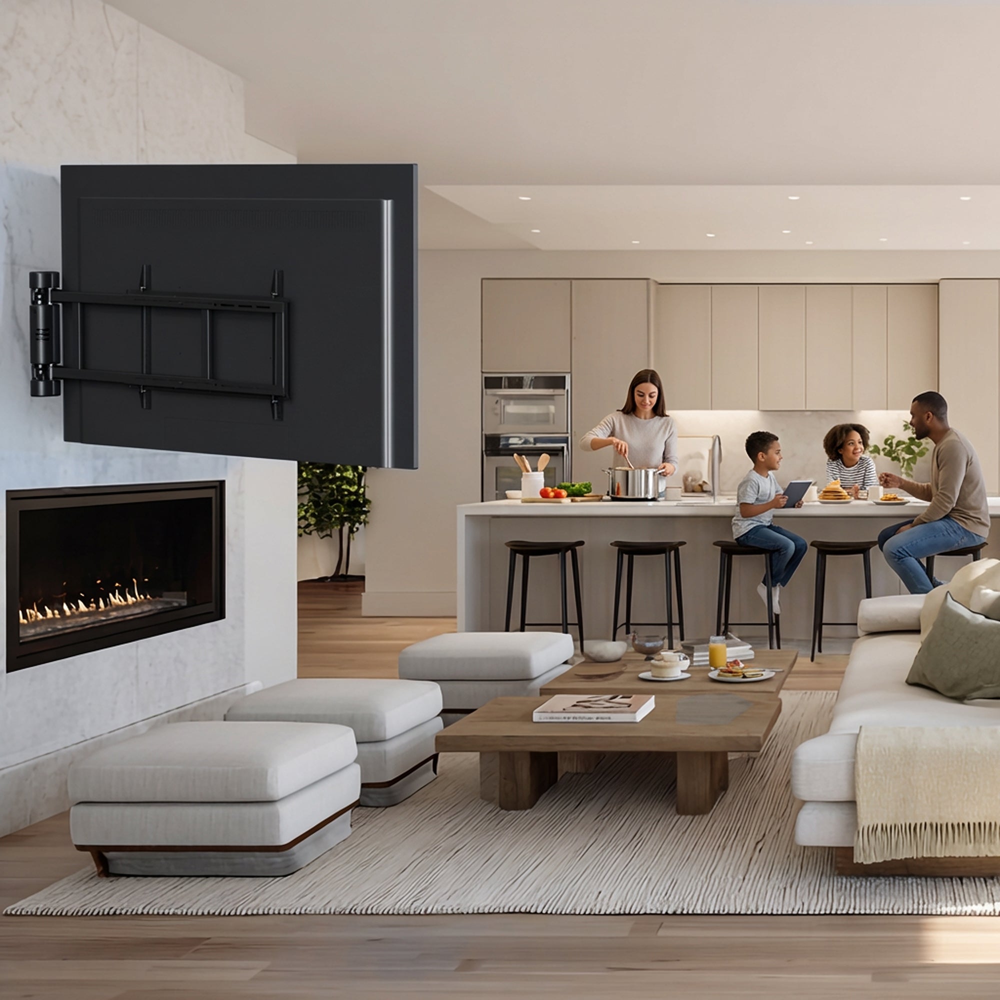Modern living room with a TV mounted on the wall, fireplace, and people in the kitchen.