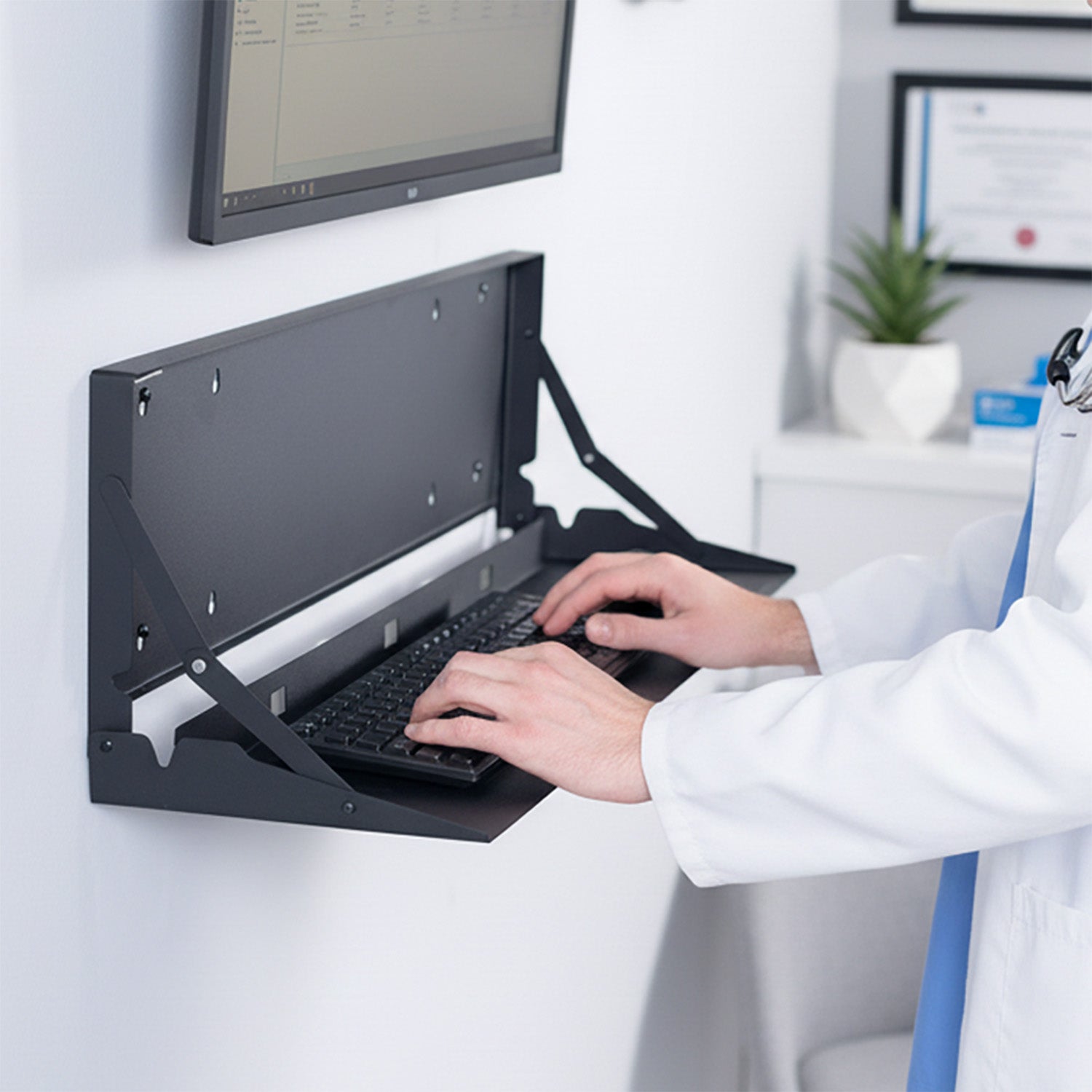 Large black wall-mounted flip down keyboard tray platform. Low profile design folds up and out of the way when not in use. Velcro included to keep keyboard in place. Fits a standard-sized keyboard and mouse (mouse pad included). Mount to drywall, wood studs, brick, or concrete.