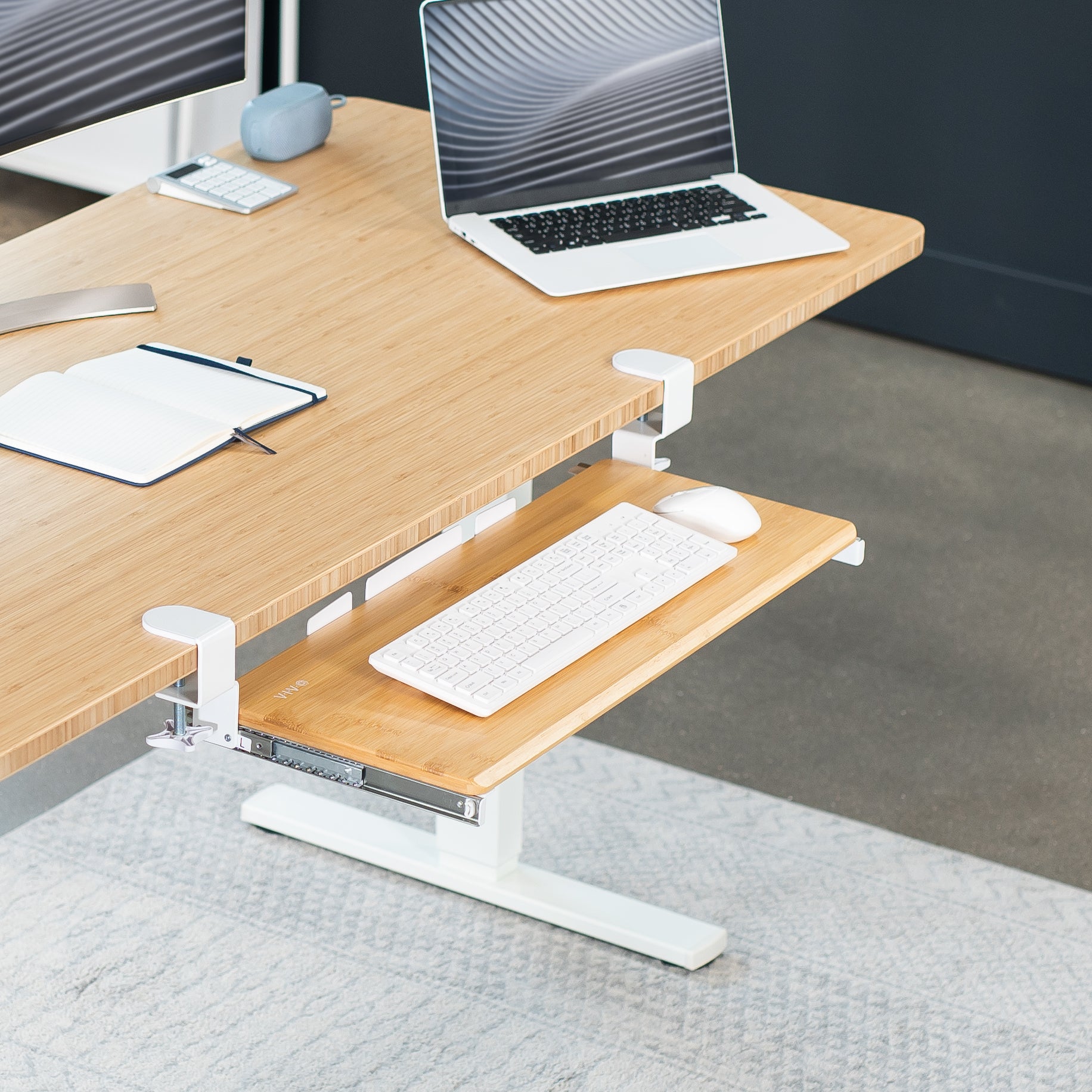 Sleek design with C-clamps and sliding tray for a clean and tidy workstation.