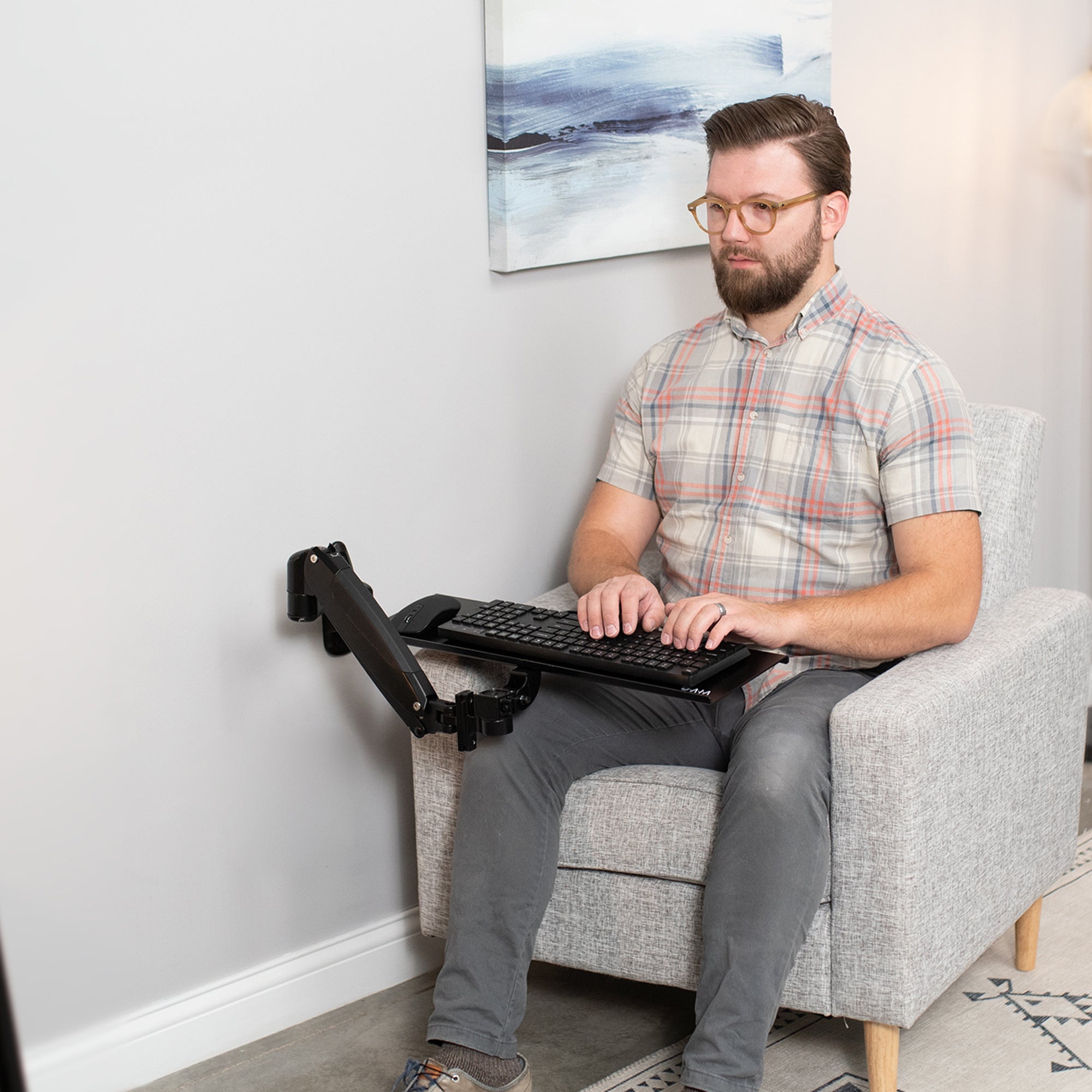 Adjustable wall mount keyboard tray.