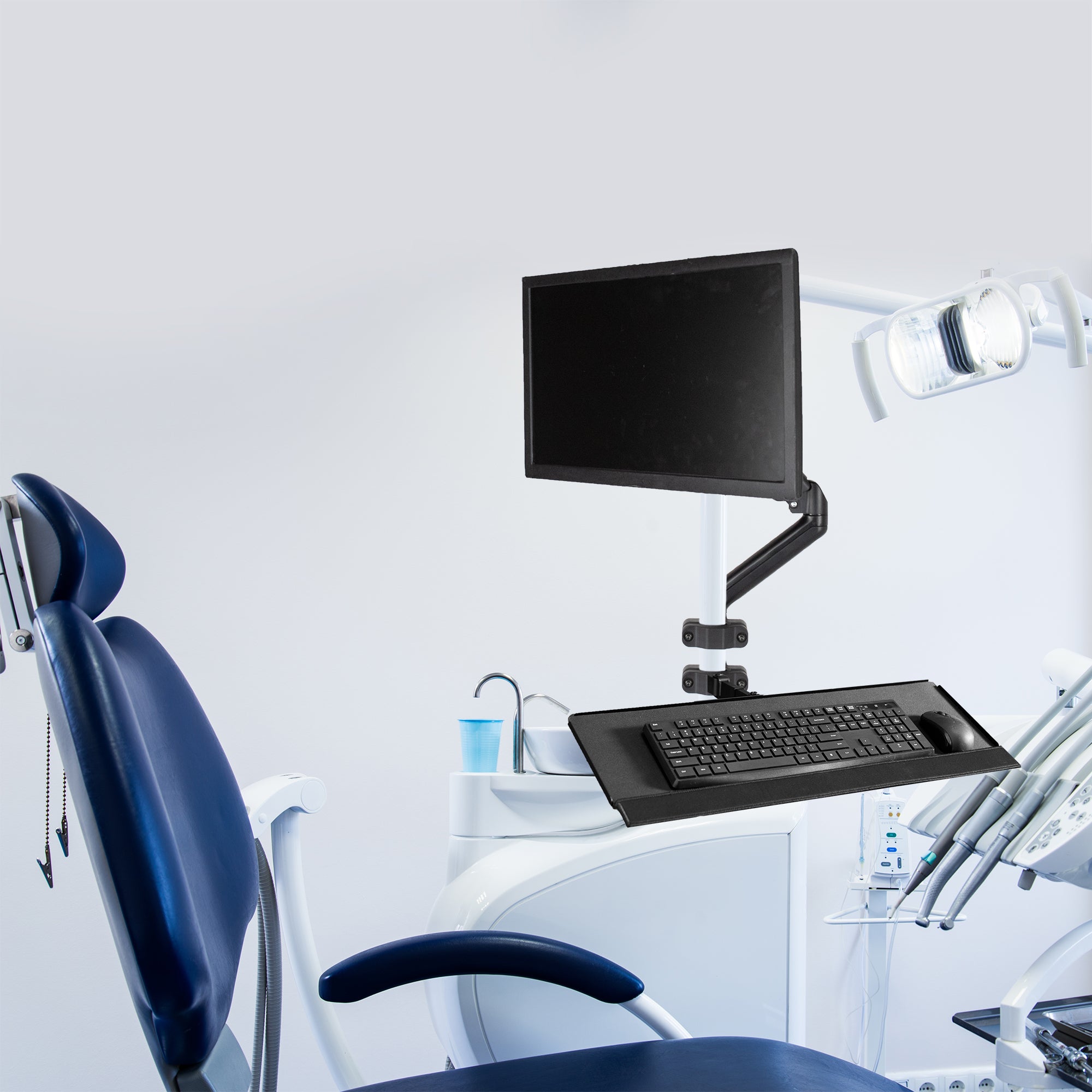 Pole Mount Tilting Keyboard Tray in healthcare setting