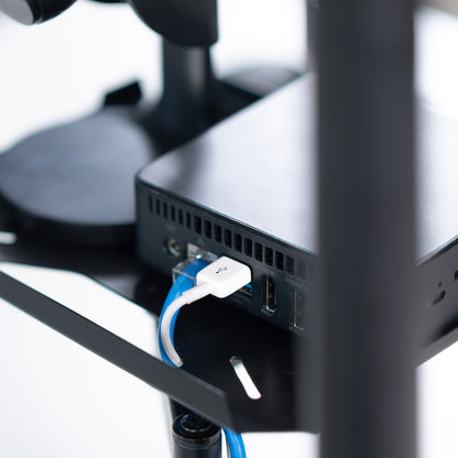 A black pole mount shelf with an articulating arm designed to attach to a pole.