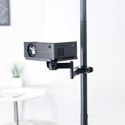 A black pole mount shelf with an articulating arm designed to attach to a pole.