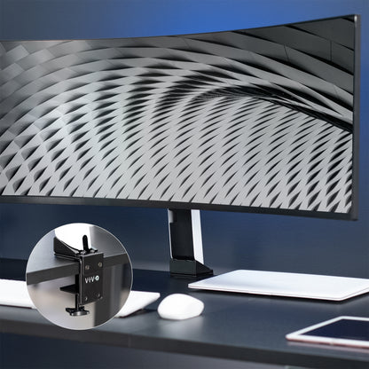 Space-saving desk clamp to mount Samsung monitor while maintaining height adjustment and articulation capabilities.