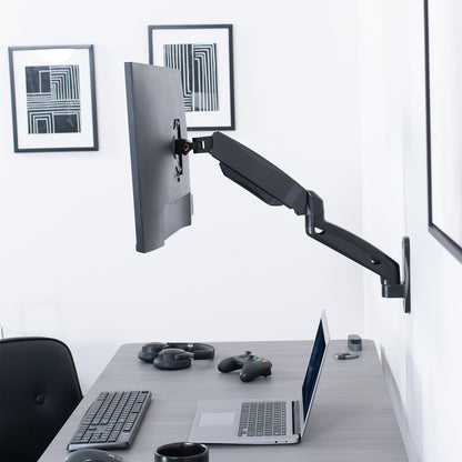 Sturdy adjustable pneumatic arm single monitor ergonomic wall mount for office workstation.