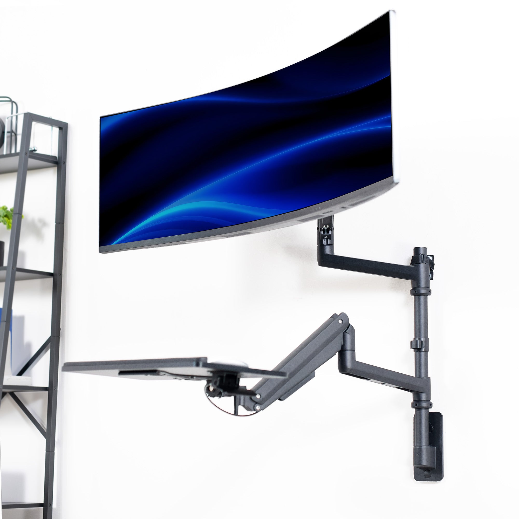 Curved monitor on a wall mount with a white background creating a floating workstation.