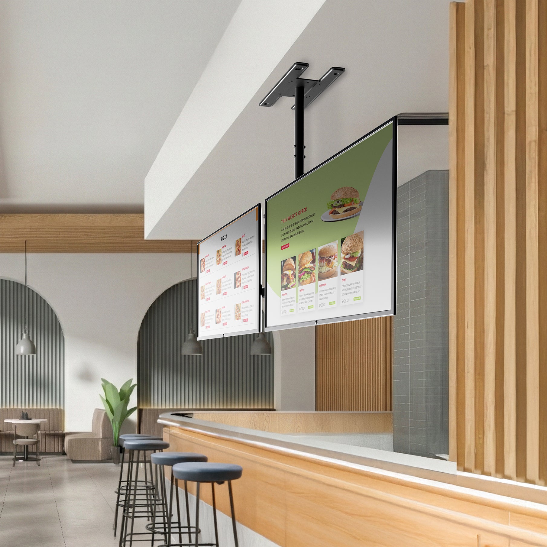 Modern restaurant interior with digital menu boards mounted on a ceiling mount for dual screens.