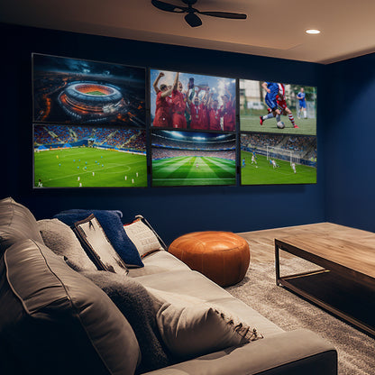 A set of black video wall mounts designed to support multiple TVs in a basement living room scene. 