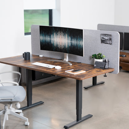 Clamp-on desk privacy panel for office workspace.