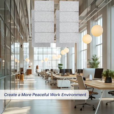 Modern office space with desks, chairs, and large windows with panels hanging from ceiling.