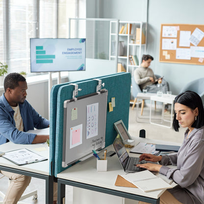 White, double-sided magnetic dry erase board in a modern office setting. 