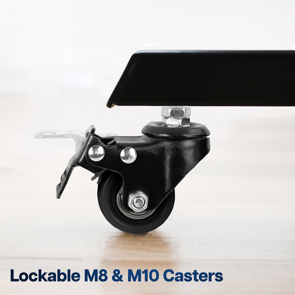 A close-up of a black lockable caster wheel mounted on a black metal frame, with text at the bottom reading 'Lockable M8 & M10 Casters' on a light wood floor background.