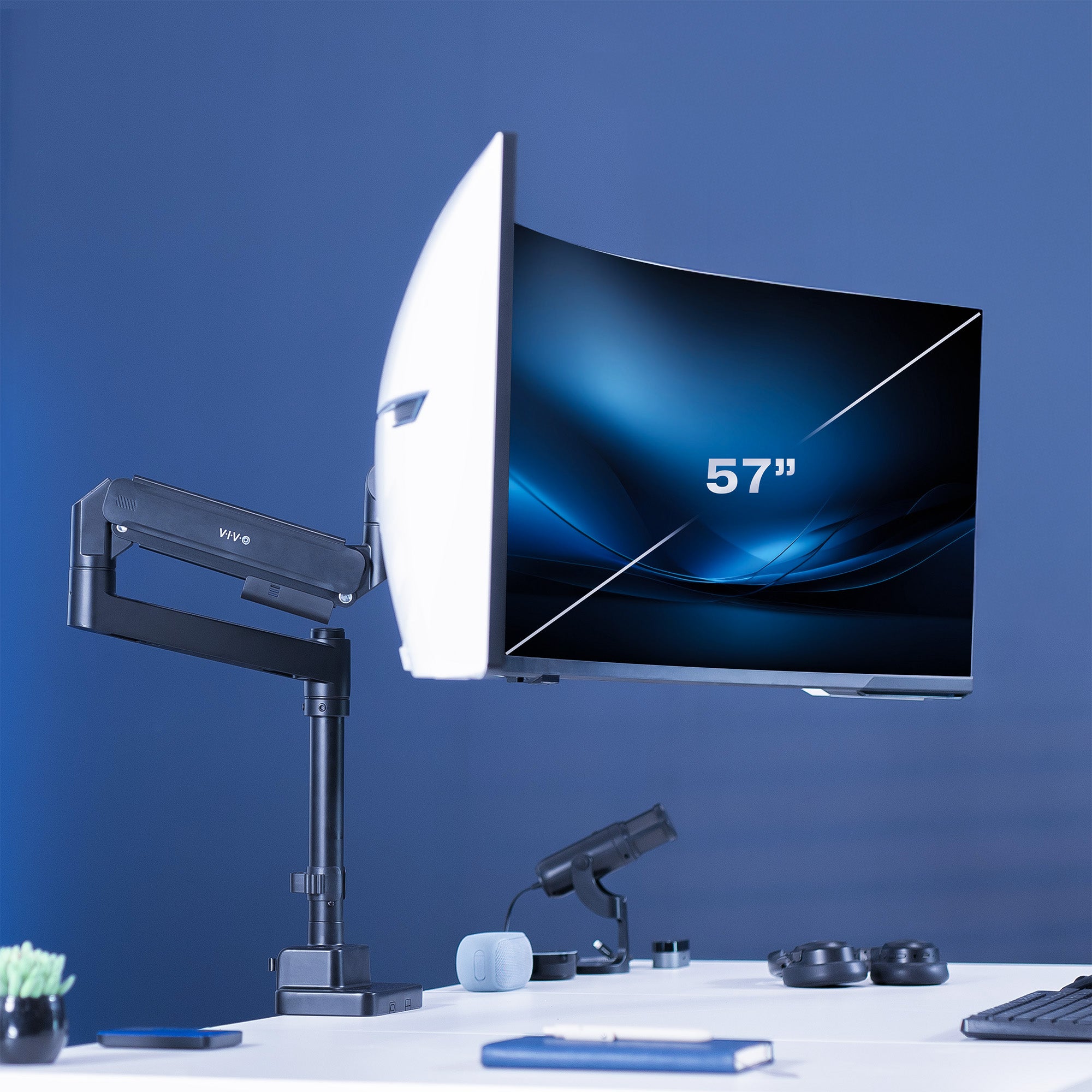 Single ultrawide monitor mounted on a pneumatic arm desk mount. 