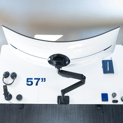 Single ultrawide monitor mounted on a pneumatic arm desk mount. 