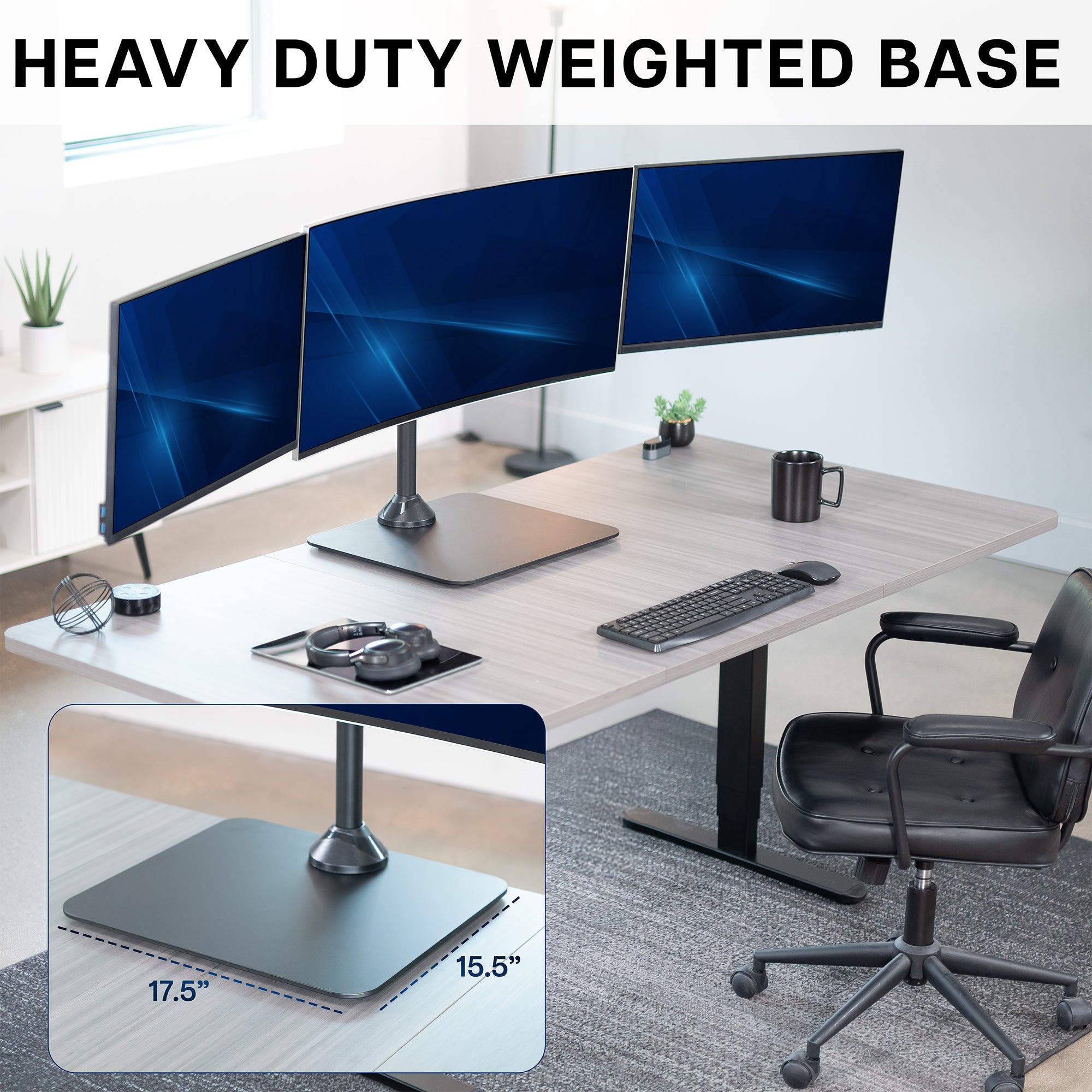 Modern office setup with a desk, chairs, and computer monitors, emphasizing a heavy-duty weighted base on a freestanding triple monitor stand.