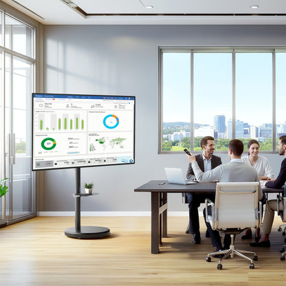 Group of people in a modern office setting with a large display screen showing graphs on a mobile TV stand.