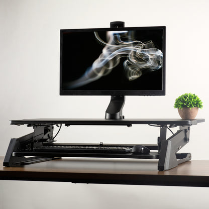 Sturdy adjustable single monitor ergonomic desk mount for office workstation.