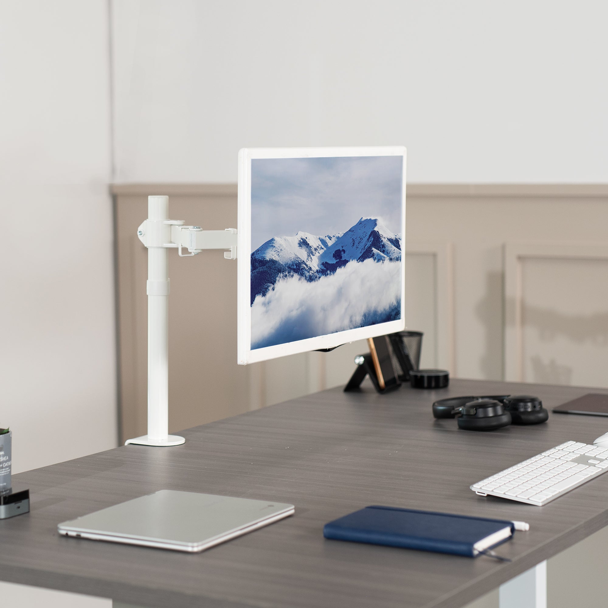 Single monitor desk mount from VIVO with articulation and cable management.