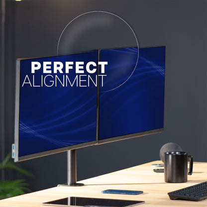 Two computer monitors on a desk with 'Perfect Alignment' text on the screen.
