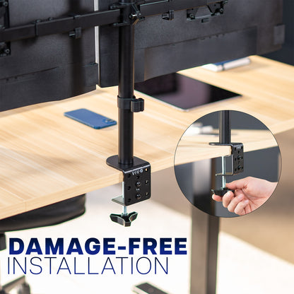 Computer monitor stand clamped on a desk with 'Damage-Free Installation' text